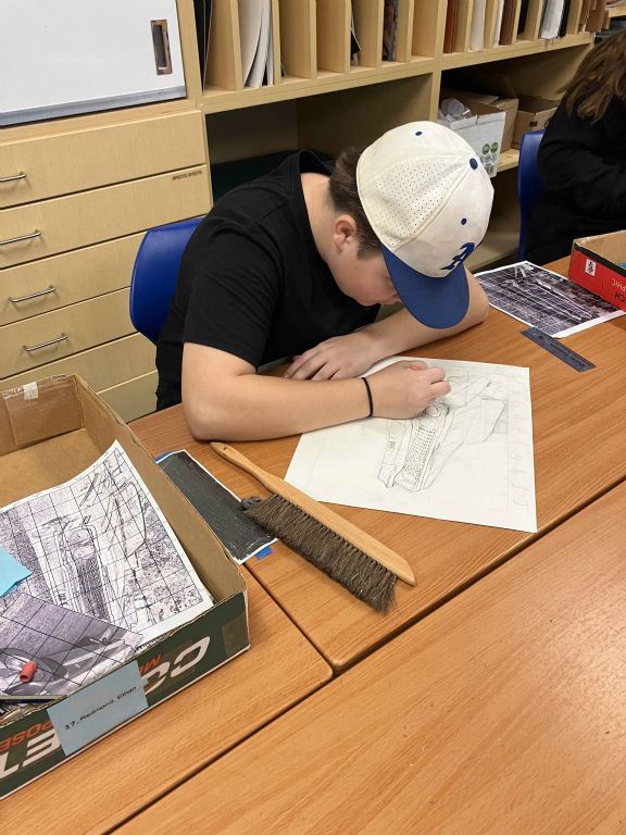 Student working on Art I Final Drawing