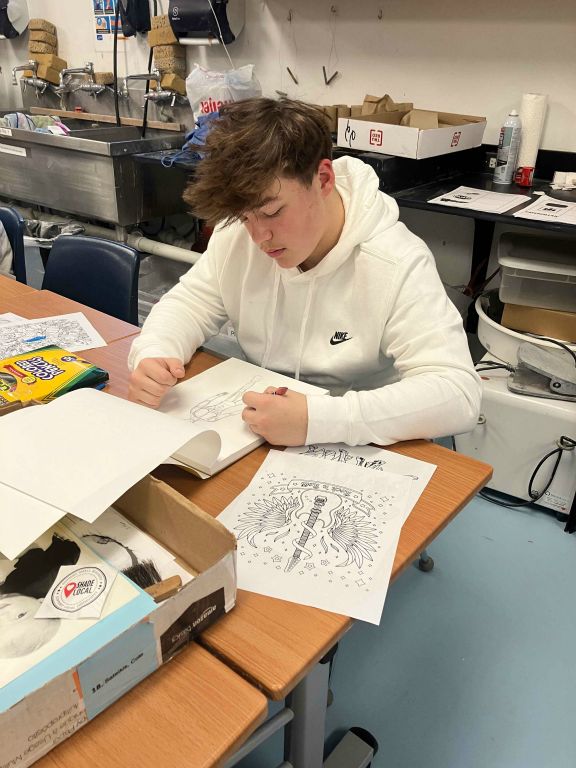 Student working on Art I Final Drawing