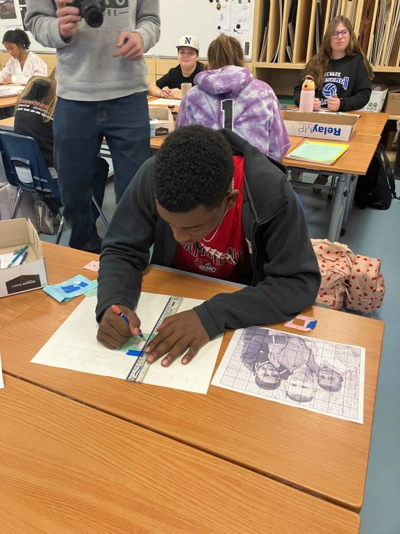 Student working on Art I Final Drawing